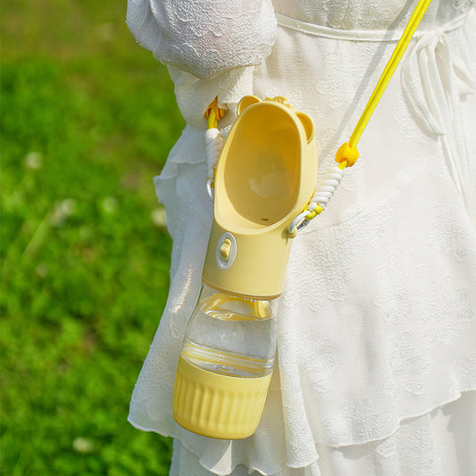 PawKind 2-in-1 Walk Bottle carried on a crossbody strap